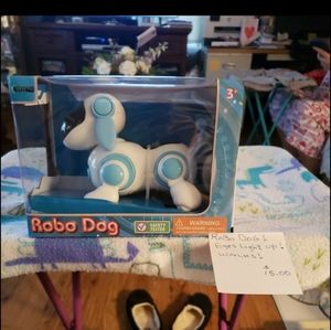 Robo Dog-  New         Robo Dog's eye's light up! Robo Dog walks! What great fun